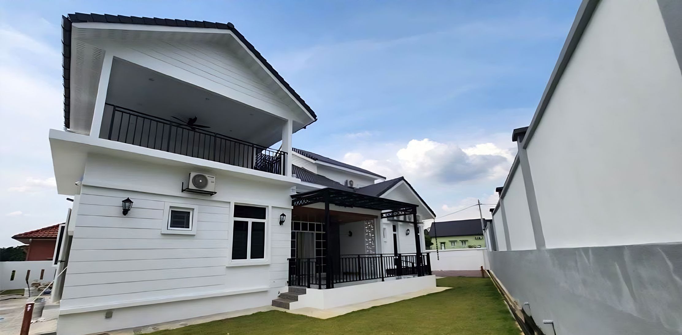 Side view with covered balcony and pergola
