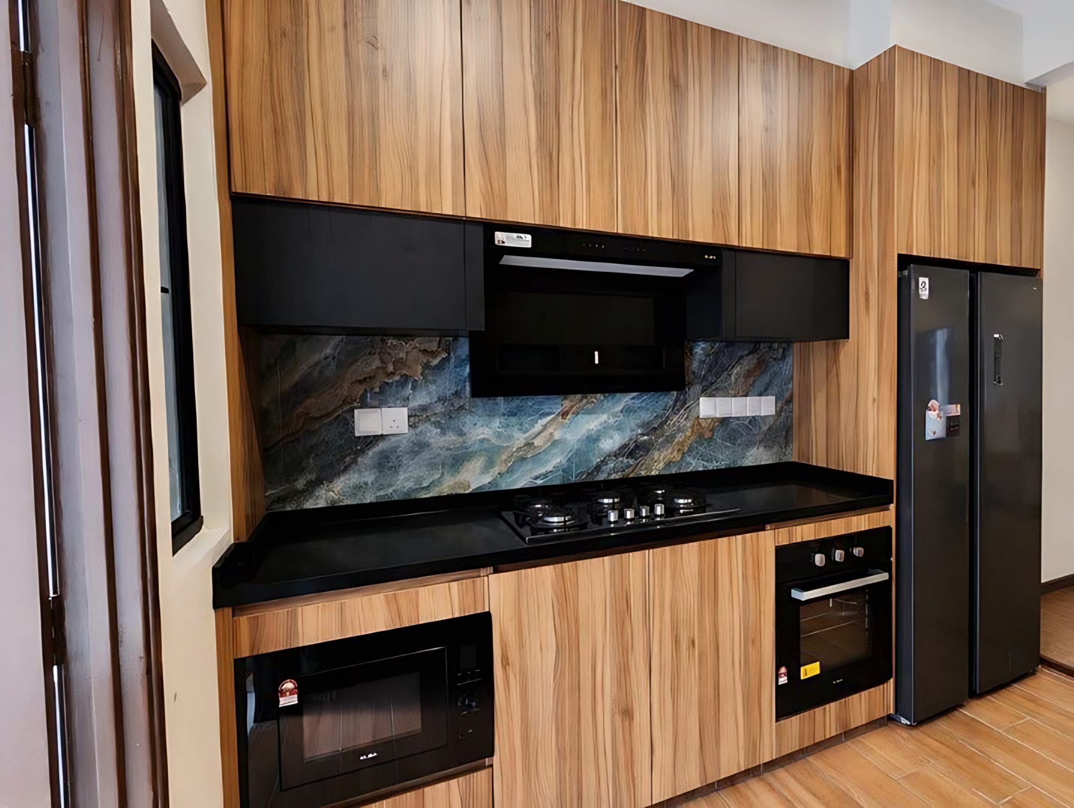 Kitchen with timber cabinetry and stone backsplash