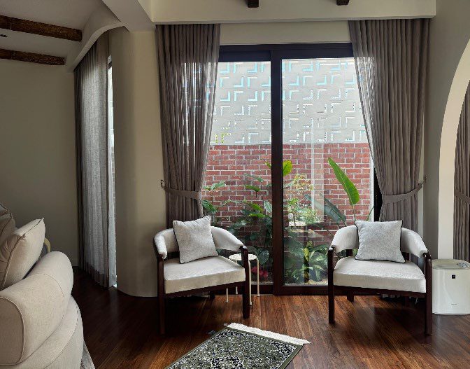 Sitting area by full-height glazing