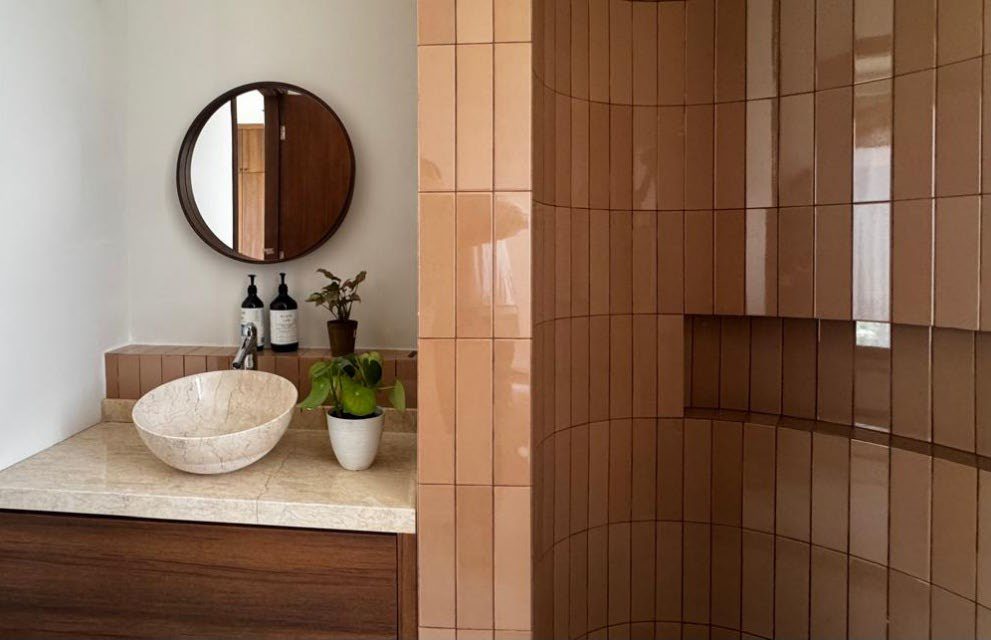 Vanity with round mirror and stone basin