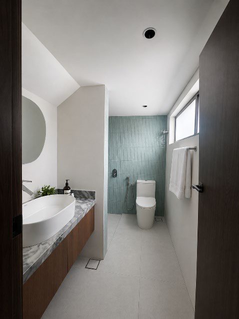 Bathroom with green tiled wall
