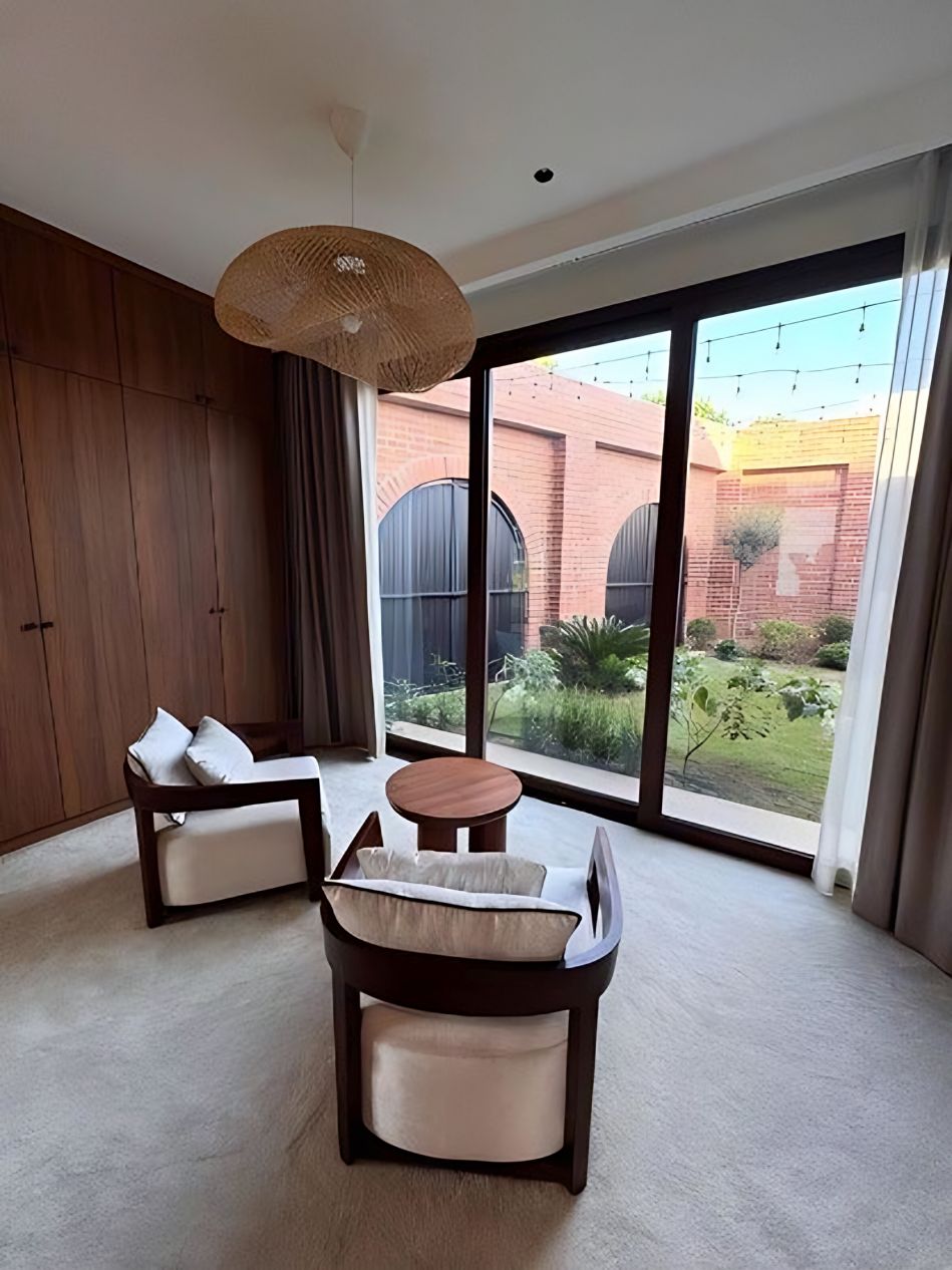 Bedroom with timber lounge chair