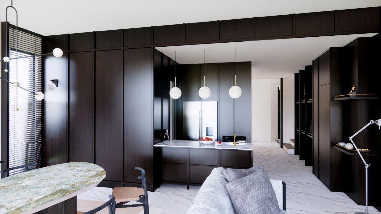 Kitchen with dark cabinetry and pendant lights