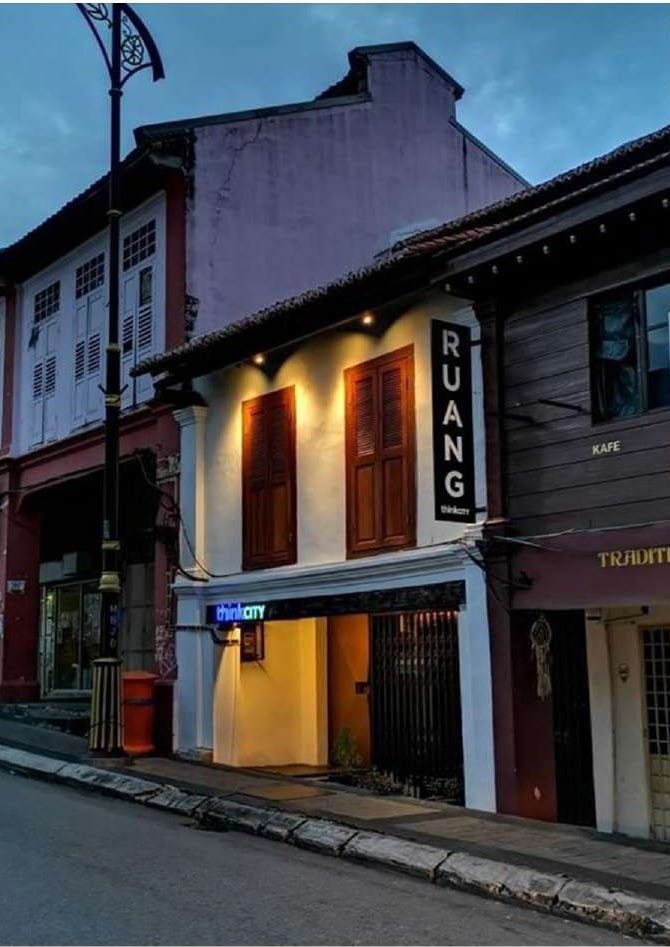Restored shophouse facade at dusk